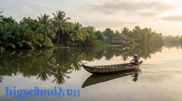 Hình ảnh con thuyền gỗ lướt nhẹ nhàng trên dòng nước phẳng lặng minh họa cho ý nghĩa của từ êm xuôi.